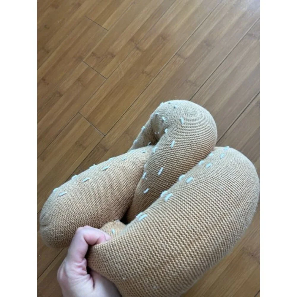 Large Estella hand-knitted organic cotton pretzel pillow